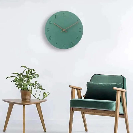 TIDLOS - Silent Wood Wall Clock mounted on a white living room wall with a teal clock face.